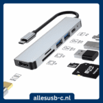 Zilveren 6-in-1 USB-C adapter met labels voor HDMI, USB 3.0, USB 2.0, SD/TF kaartlezers en PD oplaadpoort.