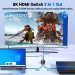 Setup met laptop en gameconsole aangesloten op één monitor via de switch, toont '2 In 1 Out' functionaliteit zonder kabels te wisselen.