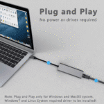 Laptop verbonden met netwerkkabel via adapter, tekst "Plug and Play - No power or driver required"